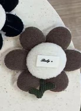 PELUCHE FLOR CAFE BOTON HUESO