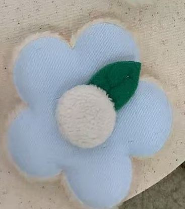 PELUCHE FLOR AZUL CON HOJITA